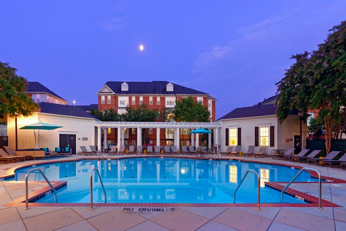 Courtyard with swimming pool, sundeck with lounge seating