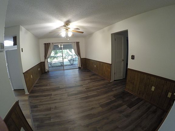 Family Room with sliding doors to access small patio and back yard.