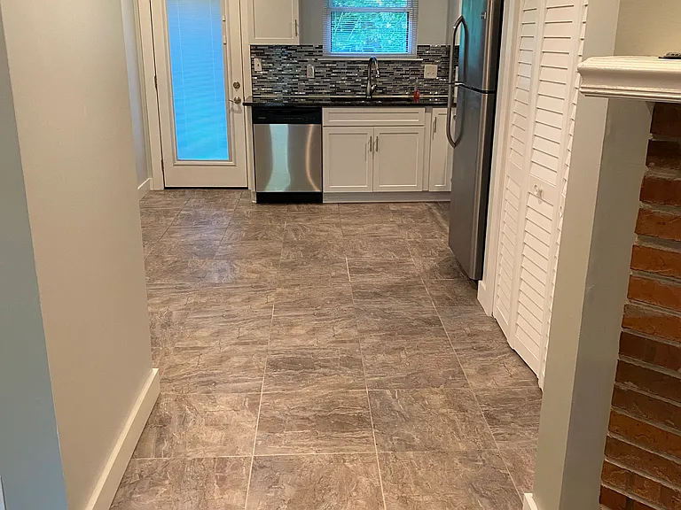 Kitchen with washer/dryer behind folding doors