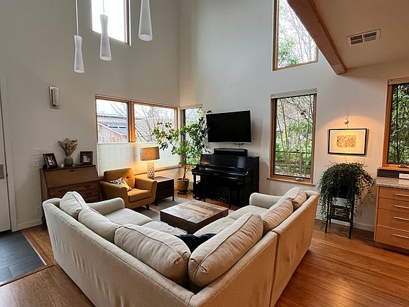 Lofted living area with wall mounted tv that lowers for better viewing.