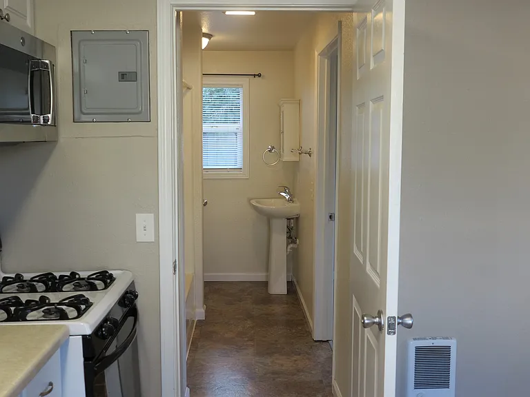View from kitchen into the bathroom.