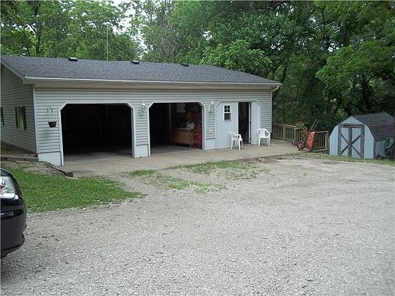 LARGE GARAGE WITH THIRD BAY CONVERTED TO SHOP AREA AND MAN CAVE!