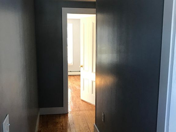 Upper hallway with refinished hardwood floor