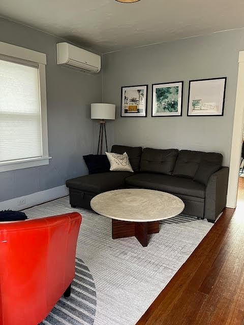 Living room with seating and large TV