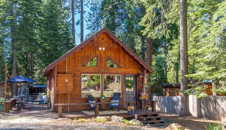 Front view of cabin with level access parking for 2 vehicles.