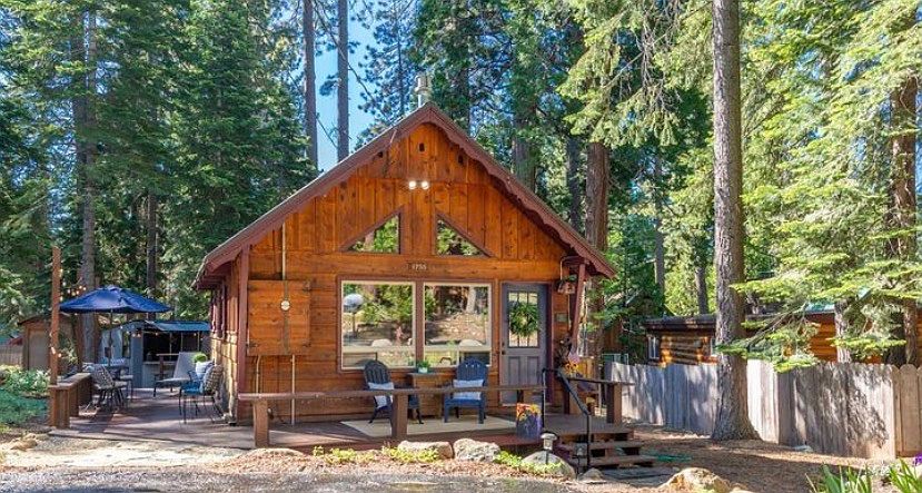 Front view of cabin with level access parking for 2 vehicles.