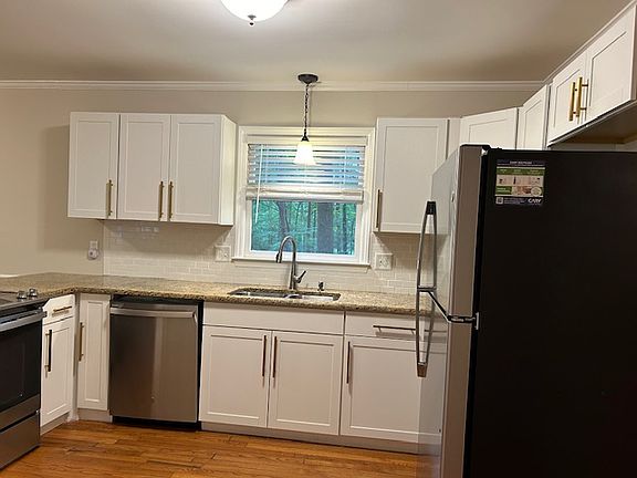 Kitchen, updated cabinetry, appliances, faucet, and lighting!
