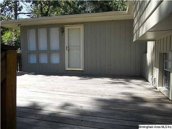 Entrance to bonus room from driveway and flower box to make the side entrance more inviting.