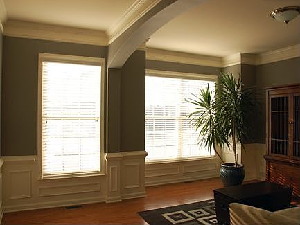Elegant paneling, crown molding, and double chair rails make this room a great