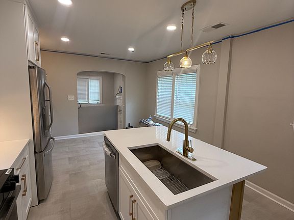 Dishwasher and sink in island