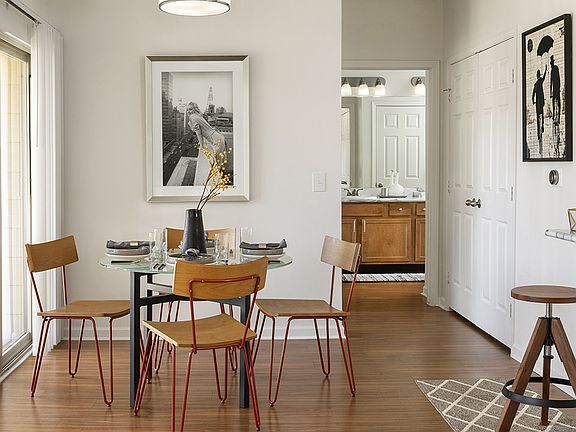 Apartment Dining room with wood floors.