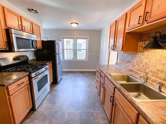 Kitchen with stainless appliances, gas range and microwave