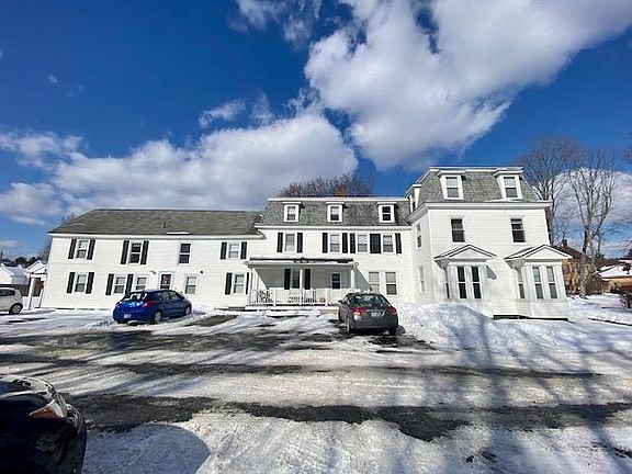 Side view of the building and one of the parking lots available for tenant use.