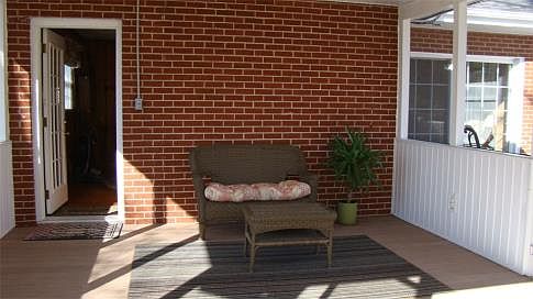 Screened In Porch off Dining Room With Trex Flooring