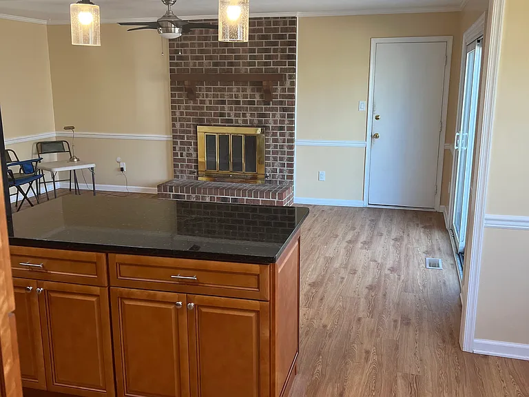Kitchen center island with cabinet space and open to the den