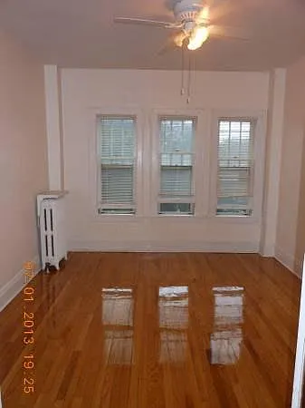 Living rooms, 9' tall ceilings, crown moldings, beautiful Oak floors and Fireplace.