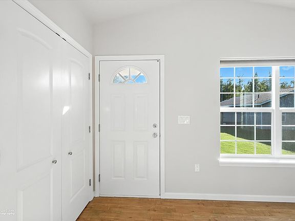 Entry. Coat closet to left with French Doors
