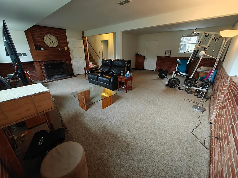 Family room with fireplace #2 and full bath, door to patio.