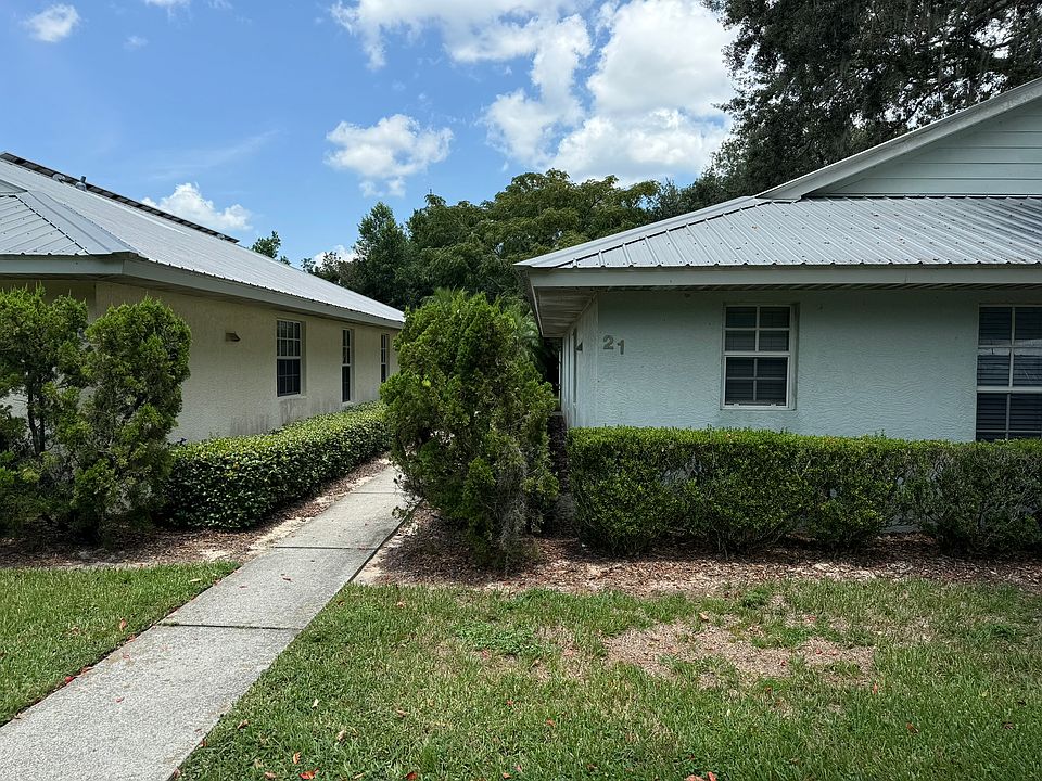 Unit 21 is a back unit. Sidewalk leads to front door.