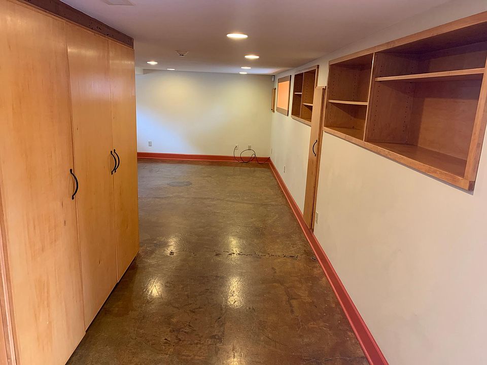 View from front door of built in closets and shelves