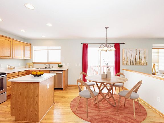 Kitchen and the dining area. Deck is outside of the patio doors (Virtually staged)