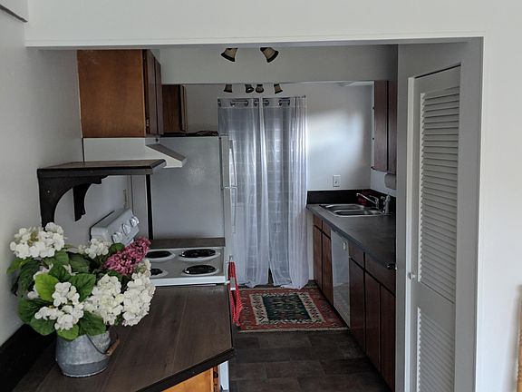 Kitchen - washer & dryer behind curtain.