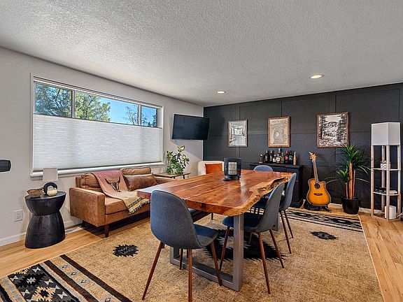 Main floor living and dining area with Smart TV