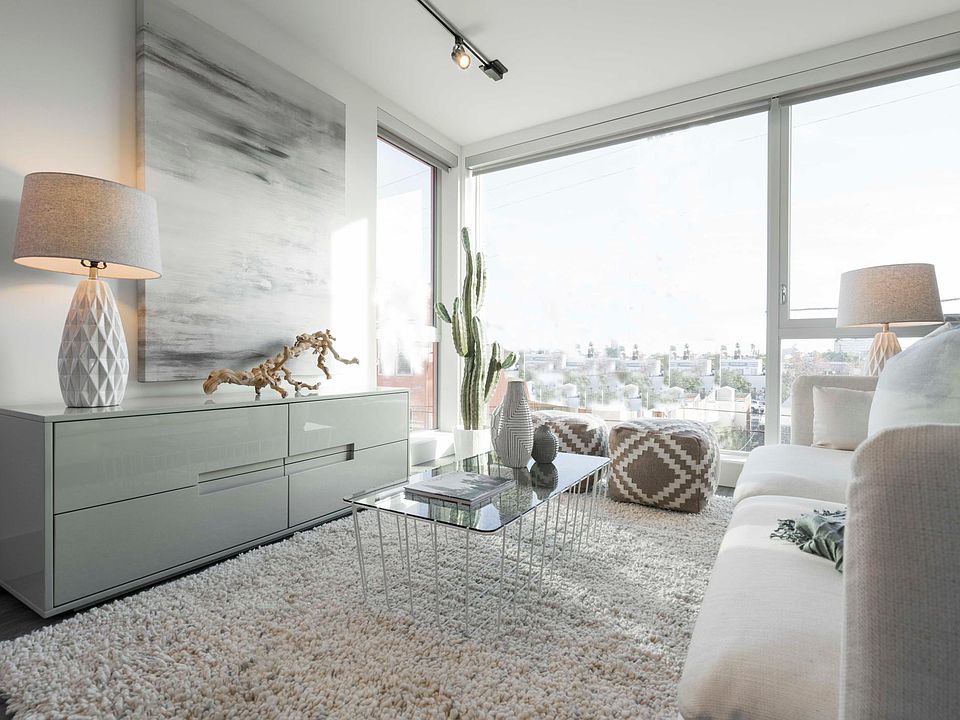 BRIGHT fun living room w huge glass walls!