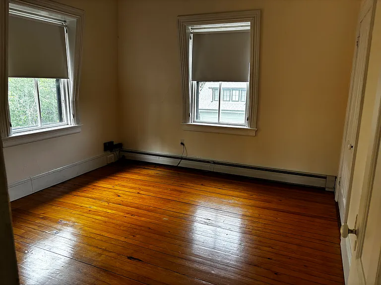 bright smaller bedroom with closet