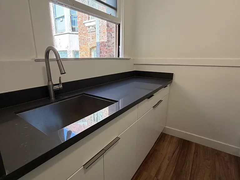 Newly remodeled kitchen with new appliances and views of interior kightwell