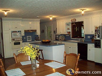 Spacious 20x18 hard wood penny peg floor kitchen