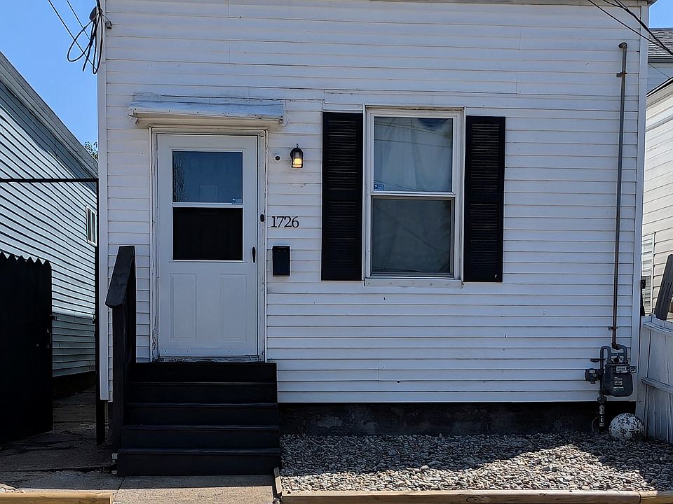 Charming exterior with low-maintenance landscaping and a freshly painted entryway_welcome home to 1726.