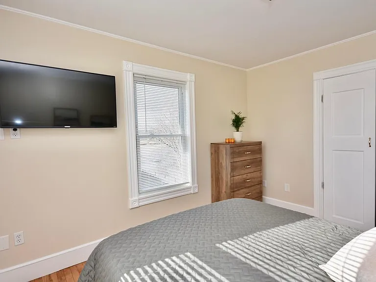 Bedroom with queen bed and 43" Smart TV, Payson Park and Back Cove View