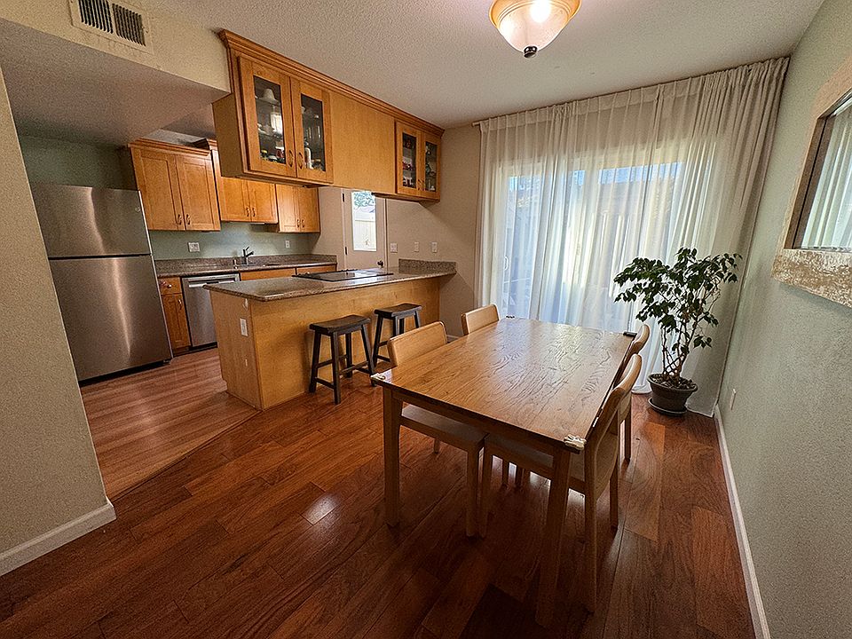 Brand new refrigerator included along with other appliances. 

Dining table and chairs are not included