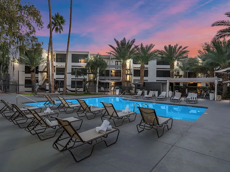 Experience Arizona twilight where vibrant skies reflect off crystal clear waters. Unwind in style with hightop seating, shaded umbrellas, and the perfect evening ambiance.