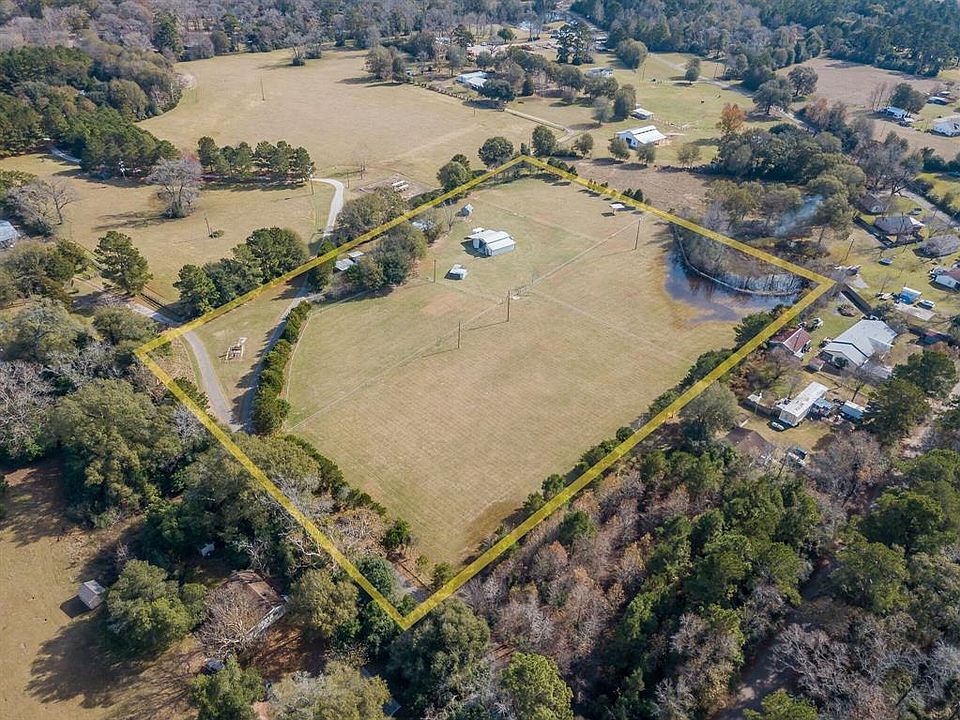 7.4 unrestricted acres in Conroe. Fully fenced with wire fencing to keep animals in. Crossed fenced with electric.