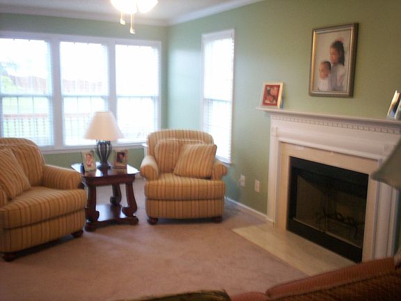 Great floor plan. Living room with marble fireplace and lots of windows!