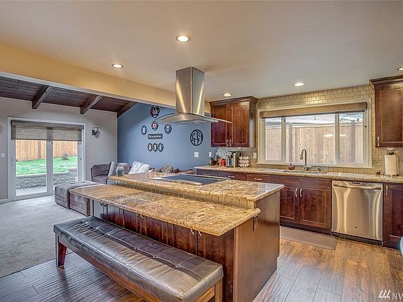 Over sized island features a drop down bar offering an additional eating space.