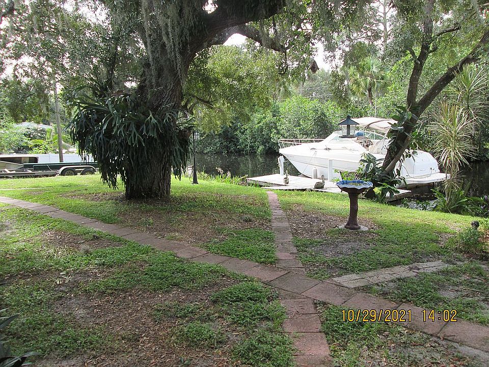Trailer, boat ramp at left
