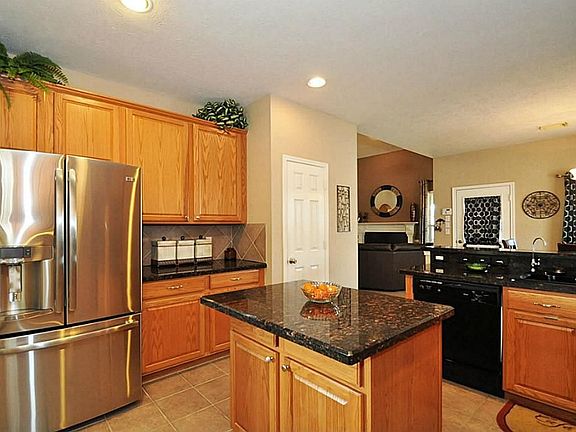 Much of our inside time is spent gathering around our kitchen appointed with GRANITE counters, travertine back splash, and a working island.