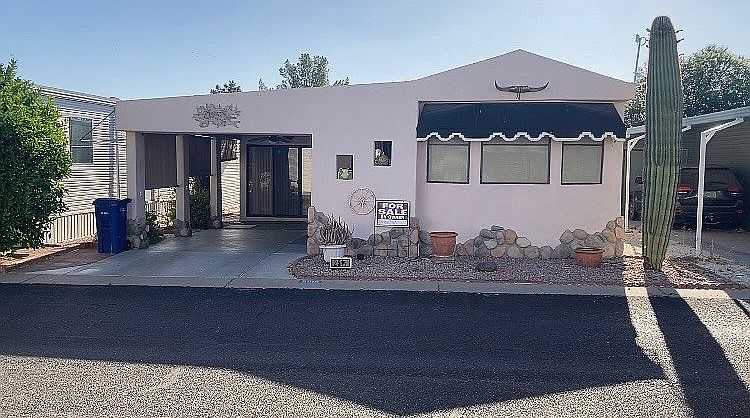 Front with covered carport