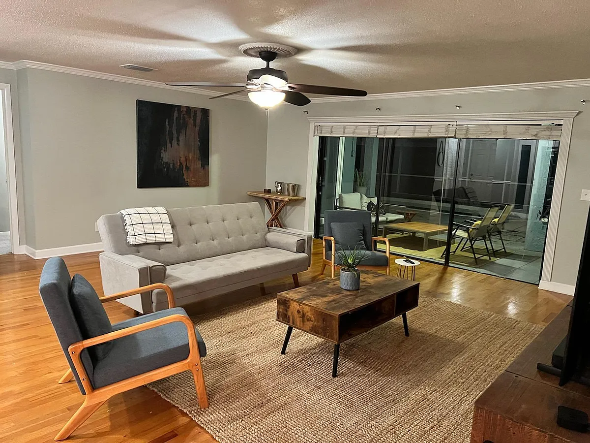 living room with pool view - 1256 Alhambra Ct