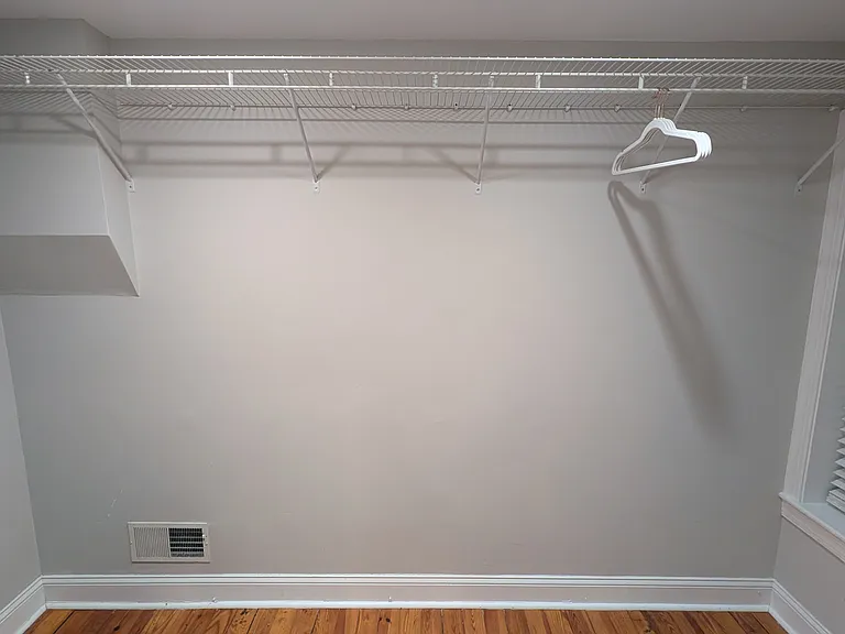 The walk-in closet in the master bedroom has wraparound shelving.