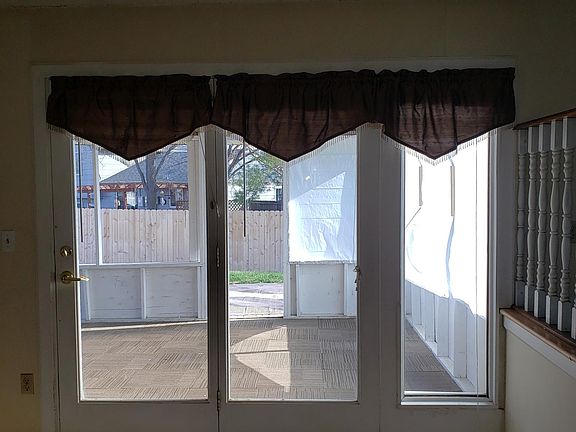 View of Enclosed Back Porch & Backyard from Family Room