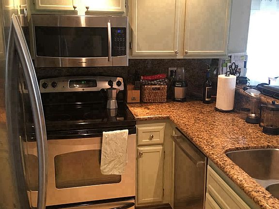 Kitchen with stainless appliances and walk in pantry