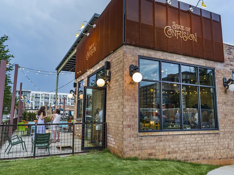 Enjoy the perfect mix of modern apartment living and vibrant local dining at Modera LoSo, conveniently located near State of Confusion. Savor unique dishes and craft cocktails in Charlotte's South End while experiencing the comfort and style of your new h