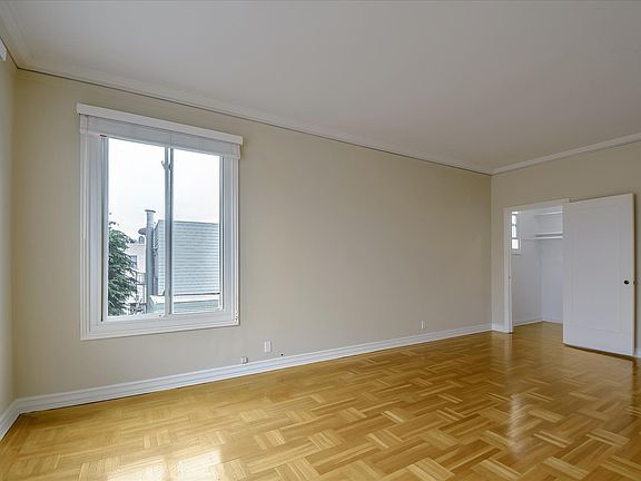 Living room has walk-in closet with window.