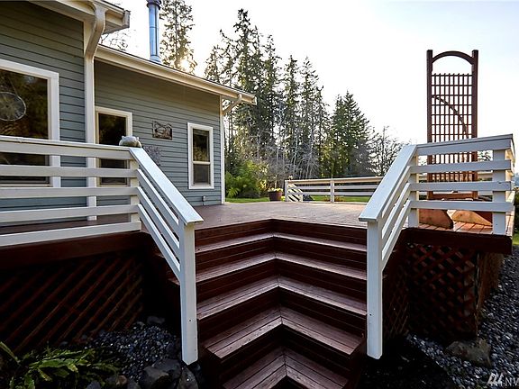 The expansive wrap-around deck has many access points, including the living areas and master suite.  The roof boasts leaf guard gutters.