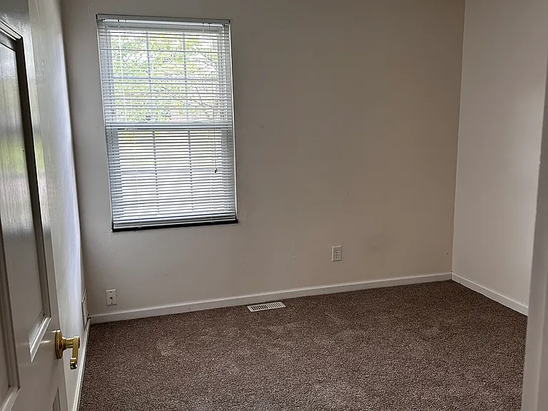 Bedroom 3 has one closet, a switched wall plug, a window with mini blinds and curtain rod.