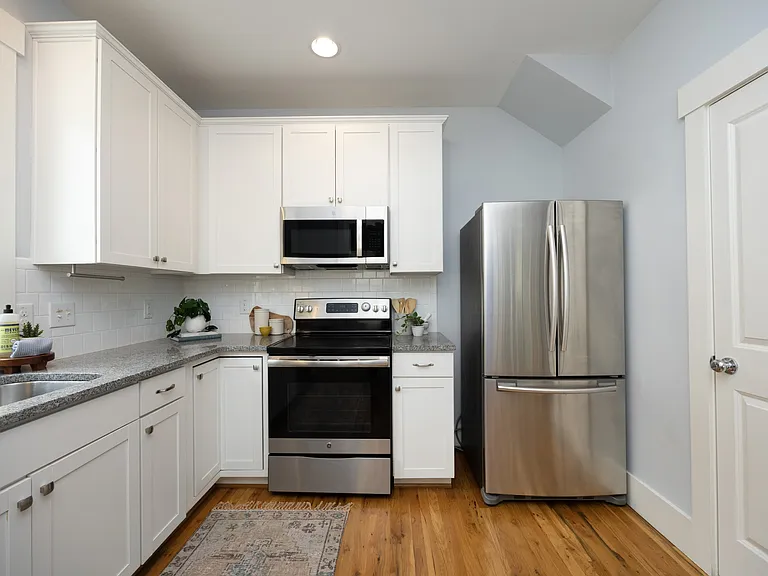Right side of Kitchen showing Range, Refrigerator and Pantry